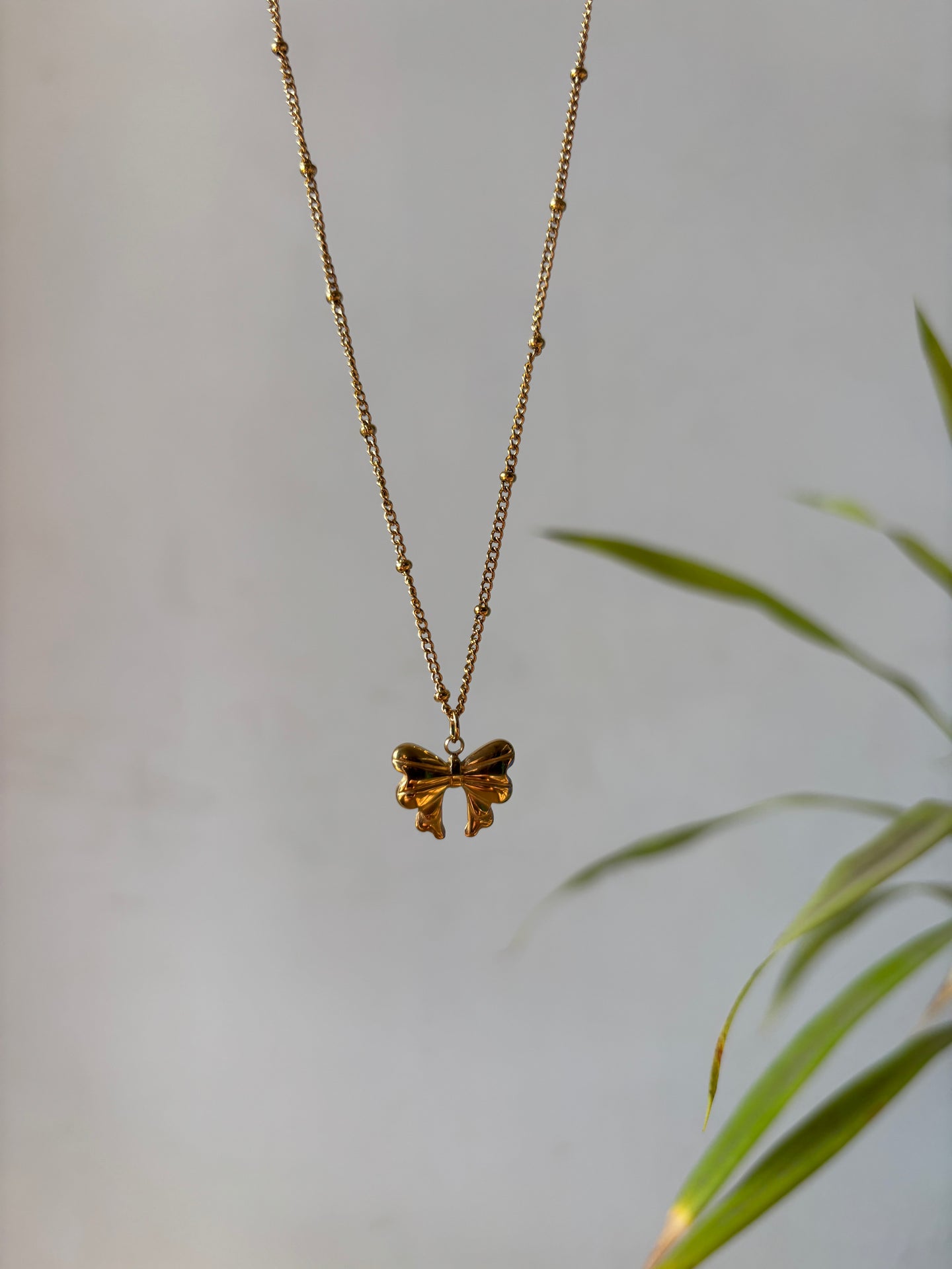 Tiny Bow Charm Necklace